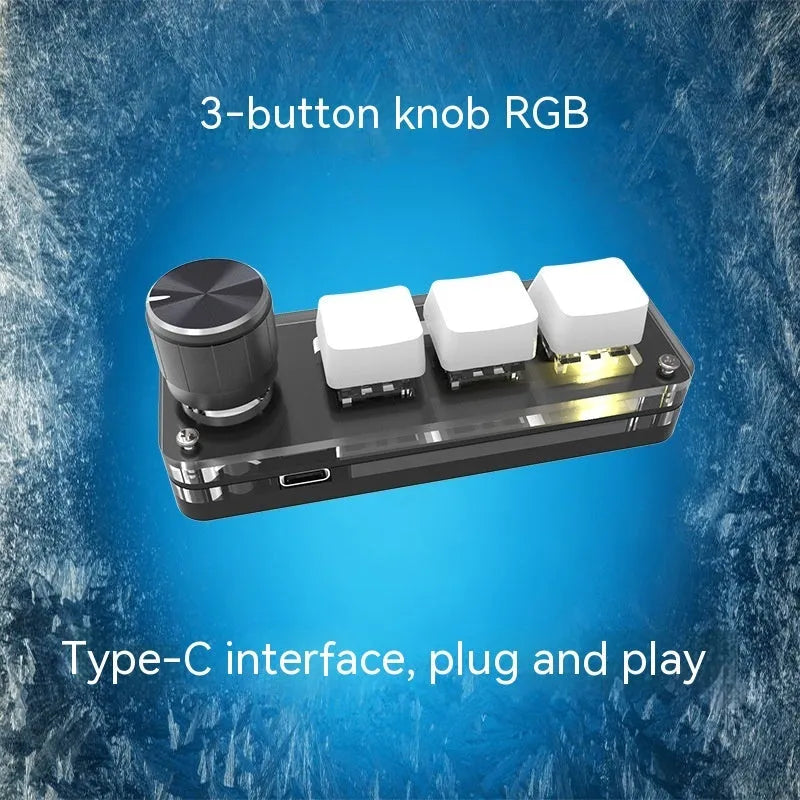 Compact black USB mini keyboard with RGB backlit keys labelled Copy and Paste on a desk.
