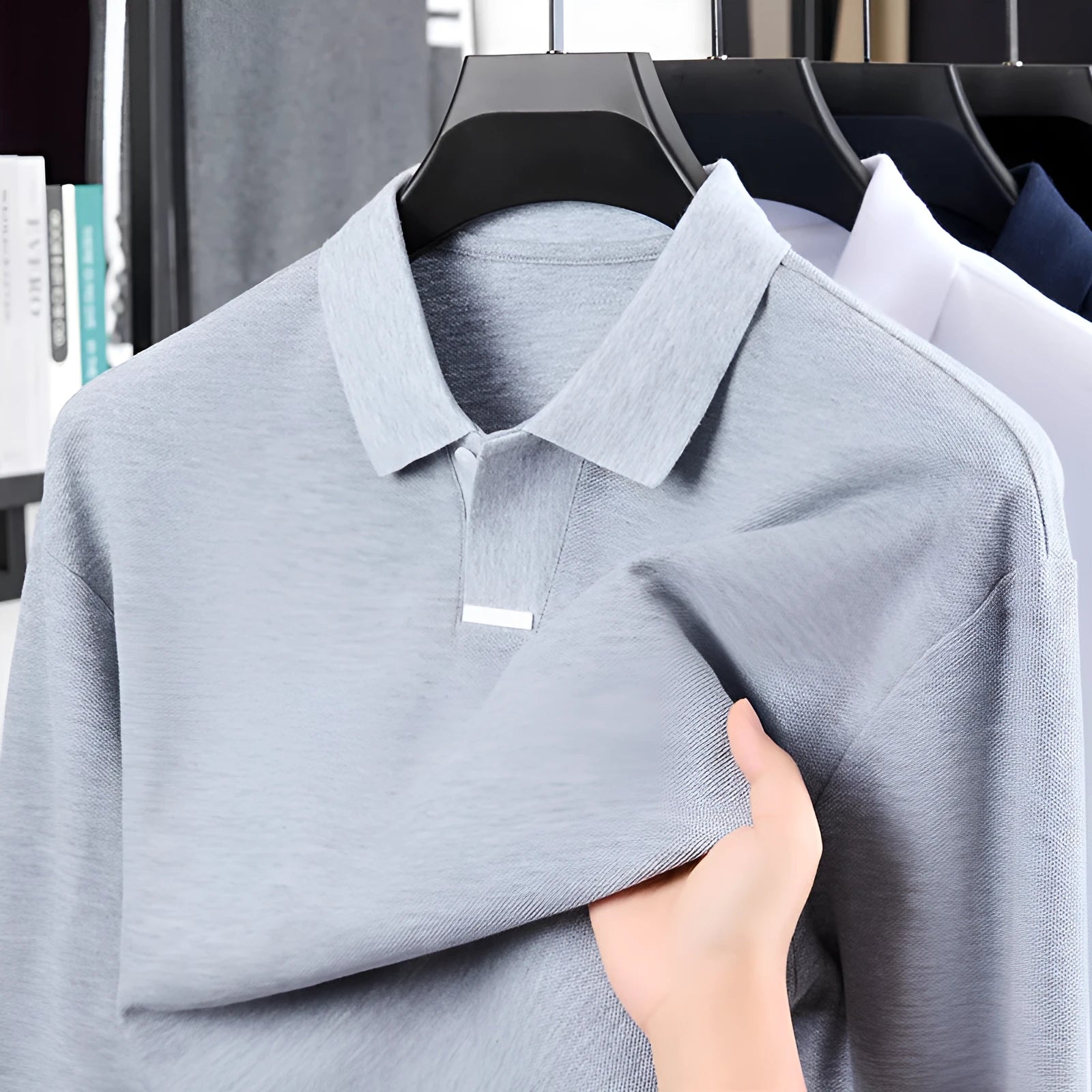 Men's grey cotton polo shirt with lapel collar and long sleeves showing loose fit design