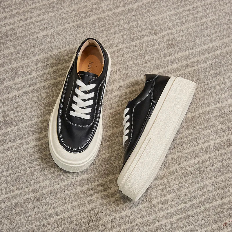 Women's black and white platform casual shoes with embossed cowhide leather and round toe design