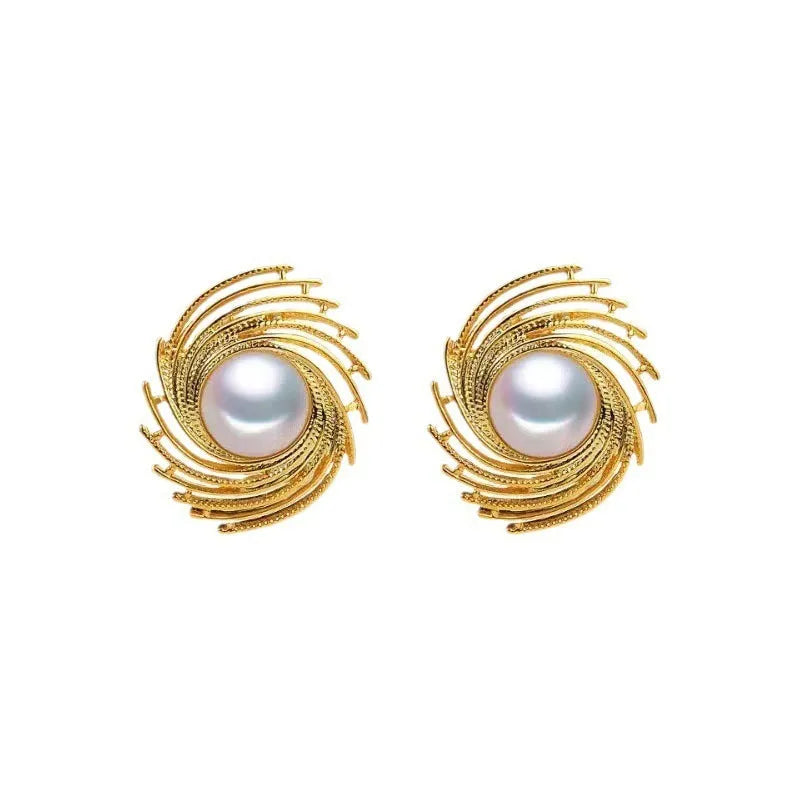 A pair of vintage floral-shaped alloy earrings with a single pearl centre and electroplated finish.