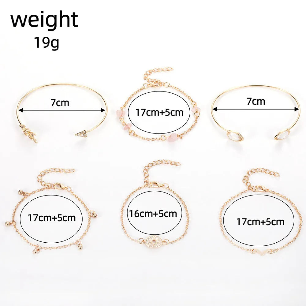 Gold-coloured zinc alloy bracelet set with arrow, water droplet, and V-shaped charms