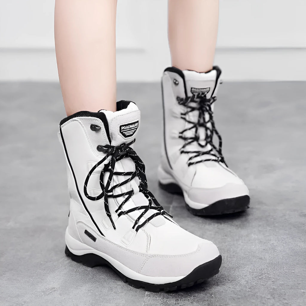 Women's mid-calf thermal snow boots in black with genuine leather upper and rubber sole