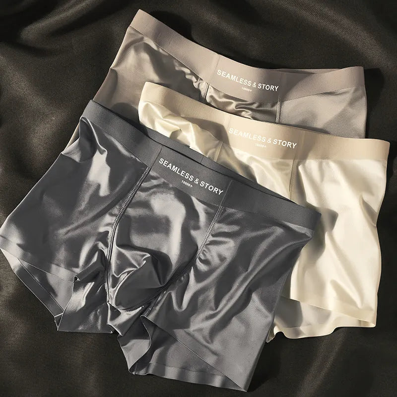 Men's light gray Ice Silk mid-waist underwear briefs laid flat.
