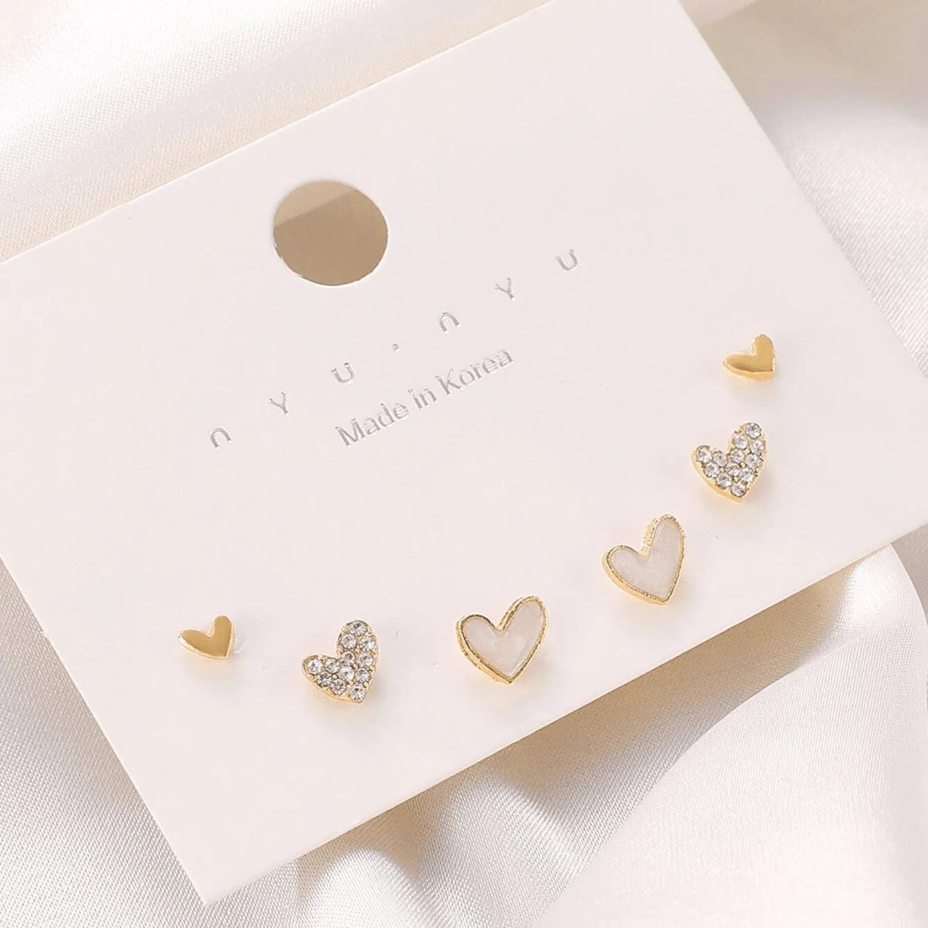 Three pairs of heart-shaped electroplated alloy earrings in girly style with love elements