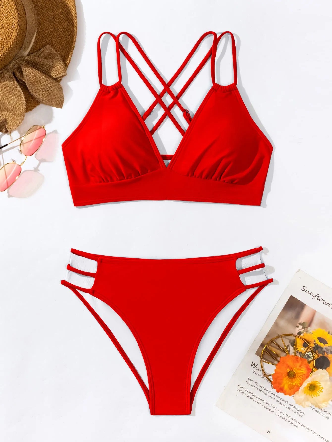 Women's black V-neck halter bikini with removable padded bra and split shorts.