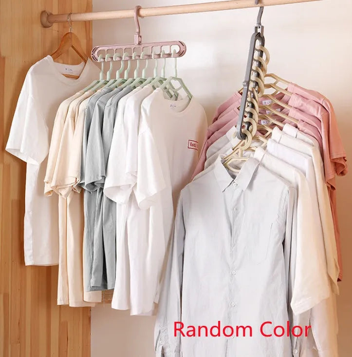 Plastic clothes hanger with rotating hook in assorted colours on white background