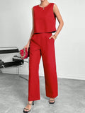 Women's red polyester two-piece set with sleeveless top and wide leg trousers displayed flat