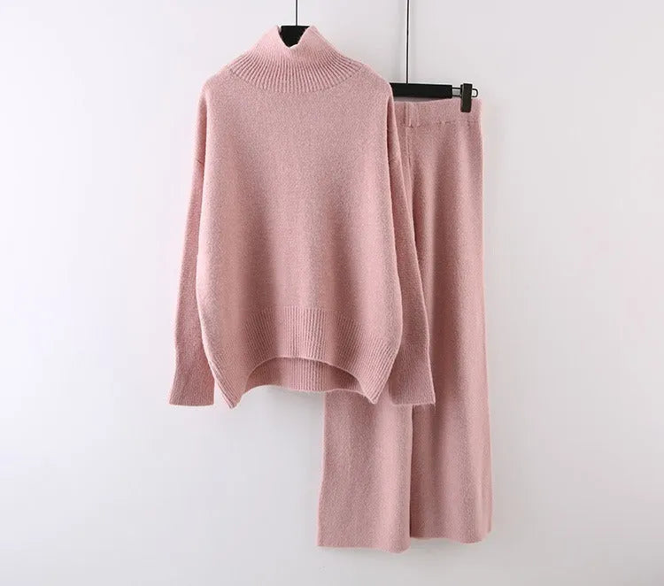 Women's beige acrylic sweater and wide-leg pants two-piece set laid flat.