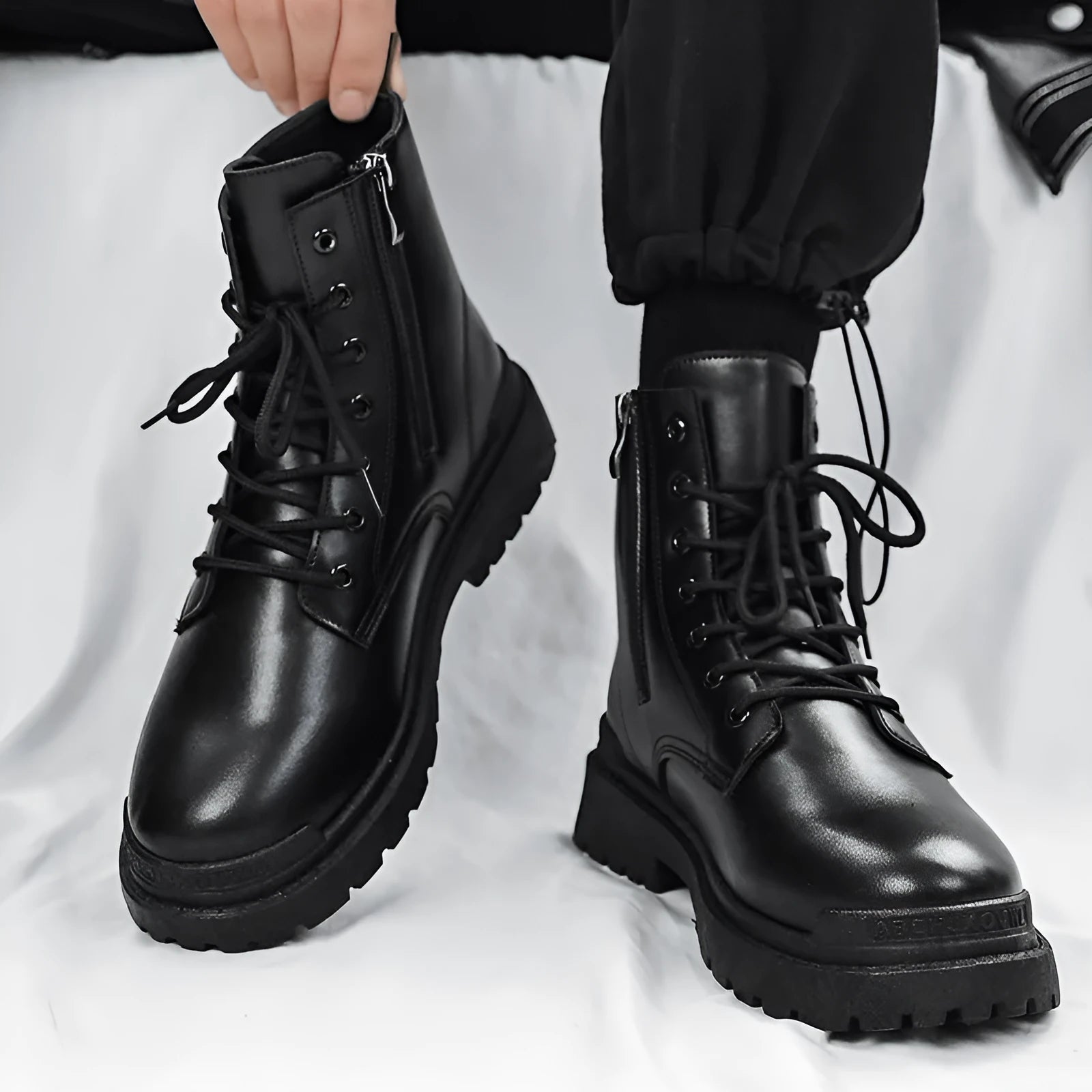 Men's black mid-top waterproof boots with rubber soles in size 42 EU