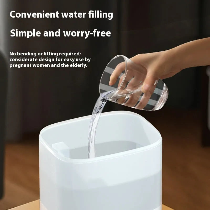 2L white plastic USB humidifier with dual spouts and night light on a desk
