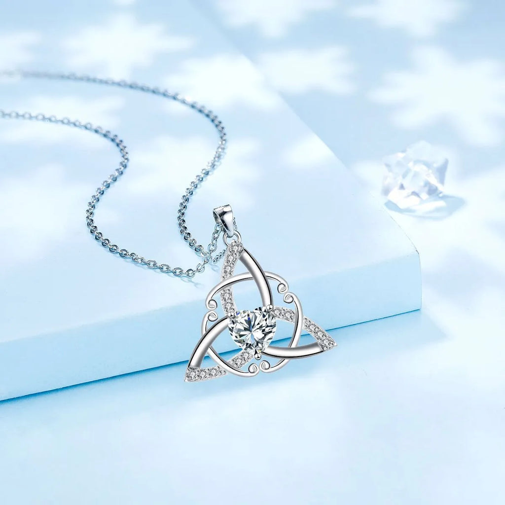 Geometric Celtic knot pendant necklace for women in a choice of blue, lvzuan, red diamond, or white diamond finish.