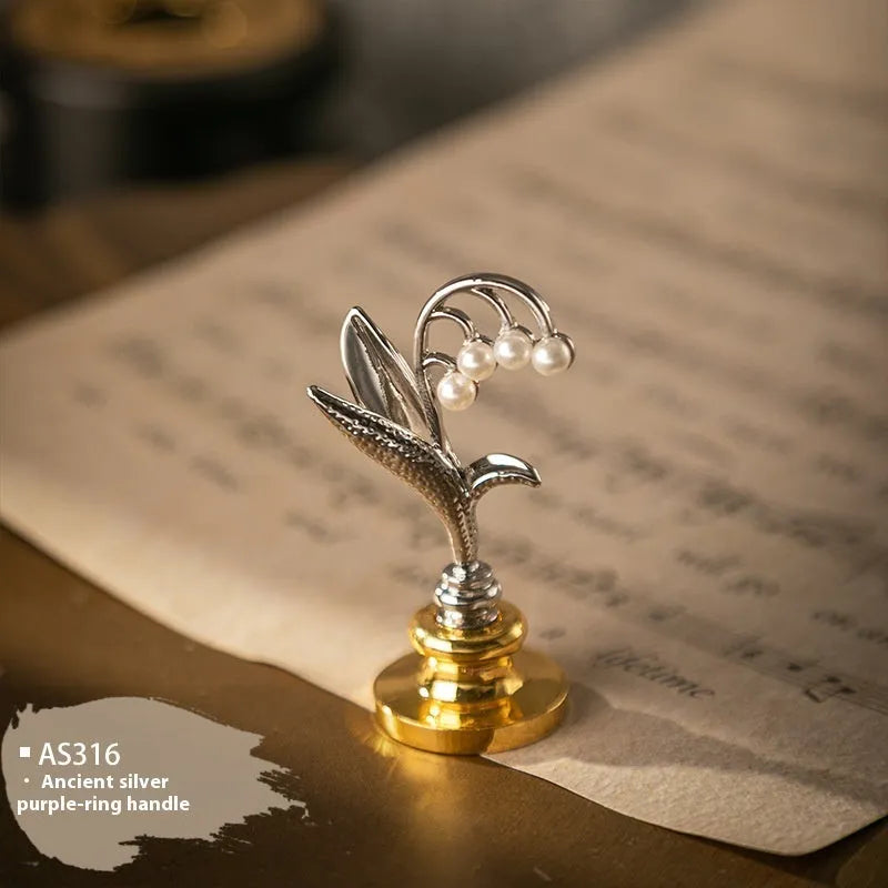 Wooden wax seal handle with decorative metal component in antique silver finish