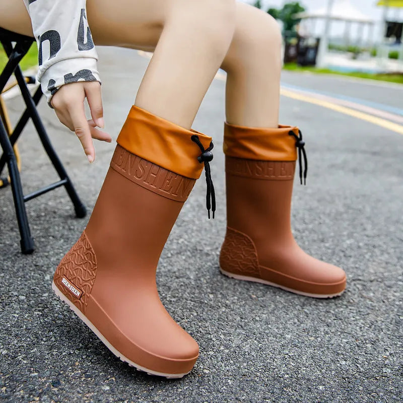 Women's PVC rain boots with non-slip soles in apricot, black, brown, or pink colours
