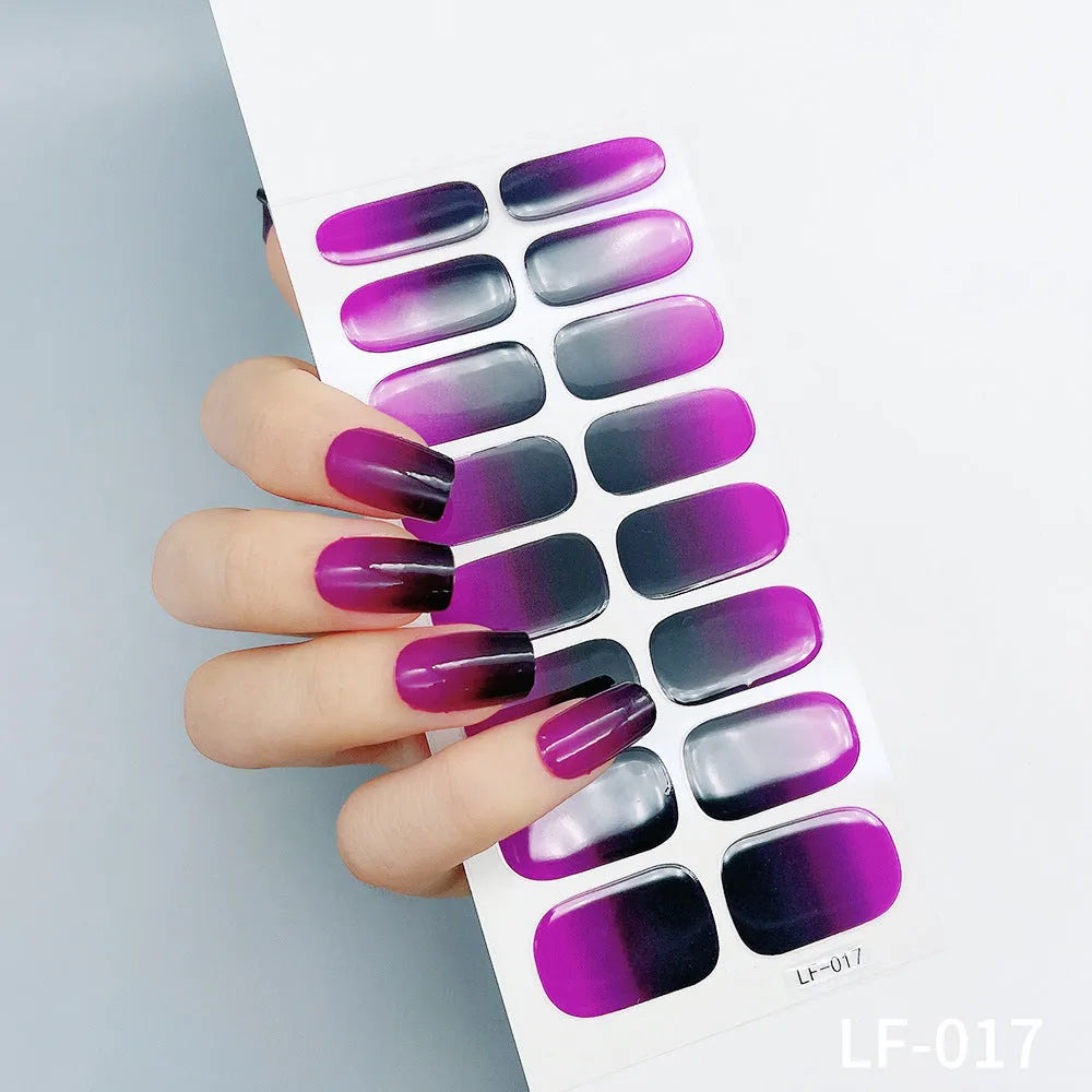 Full nail art sticker sheet showing 16 different solid colour designs including European simple nails and floral patterns