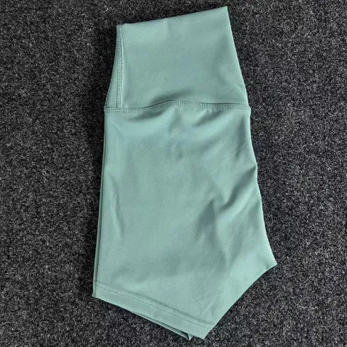 Women's high-waist yoga shorts in nylon fabric for running, sports, and cycling activities