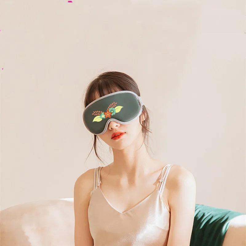 Portable pink eye SPA massage goggles showing suede shell and super fibre padding