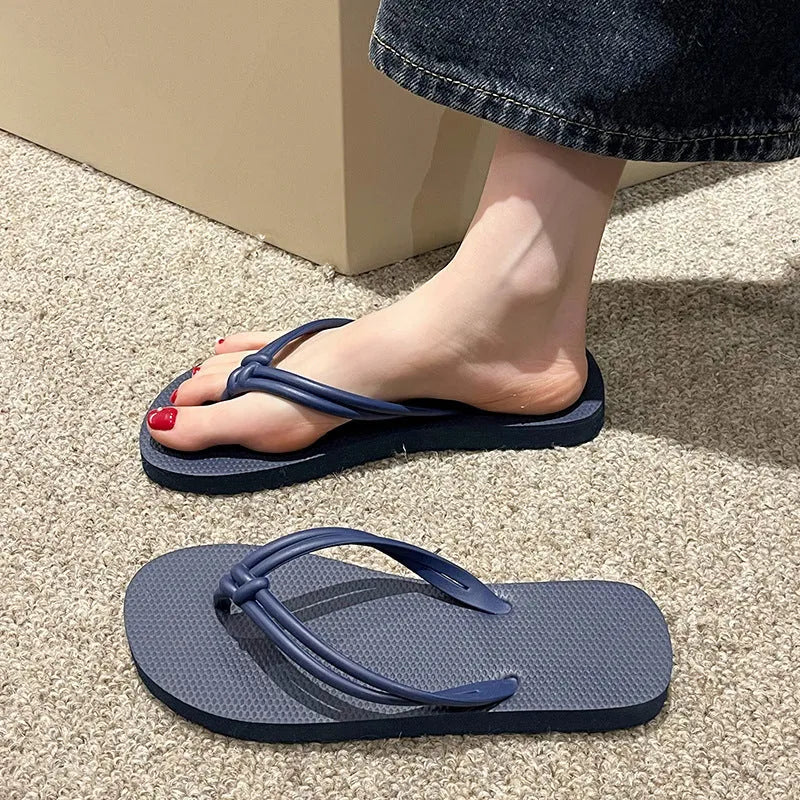 Men's closed-toe PVC flip flops in multiple colours on a plain background.