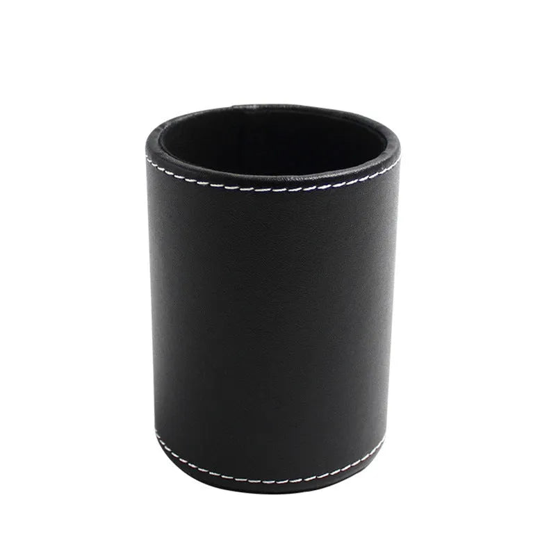 Round black leather pen holder with 8.0cm diameter on a desk