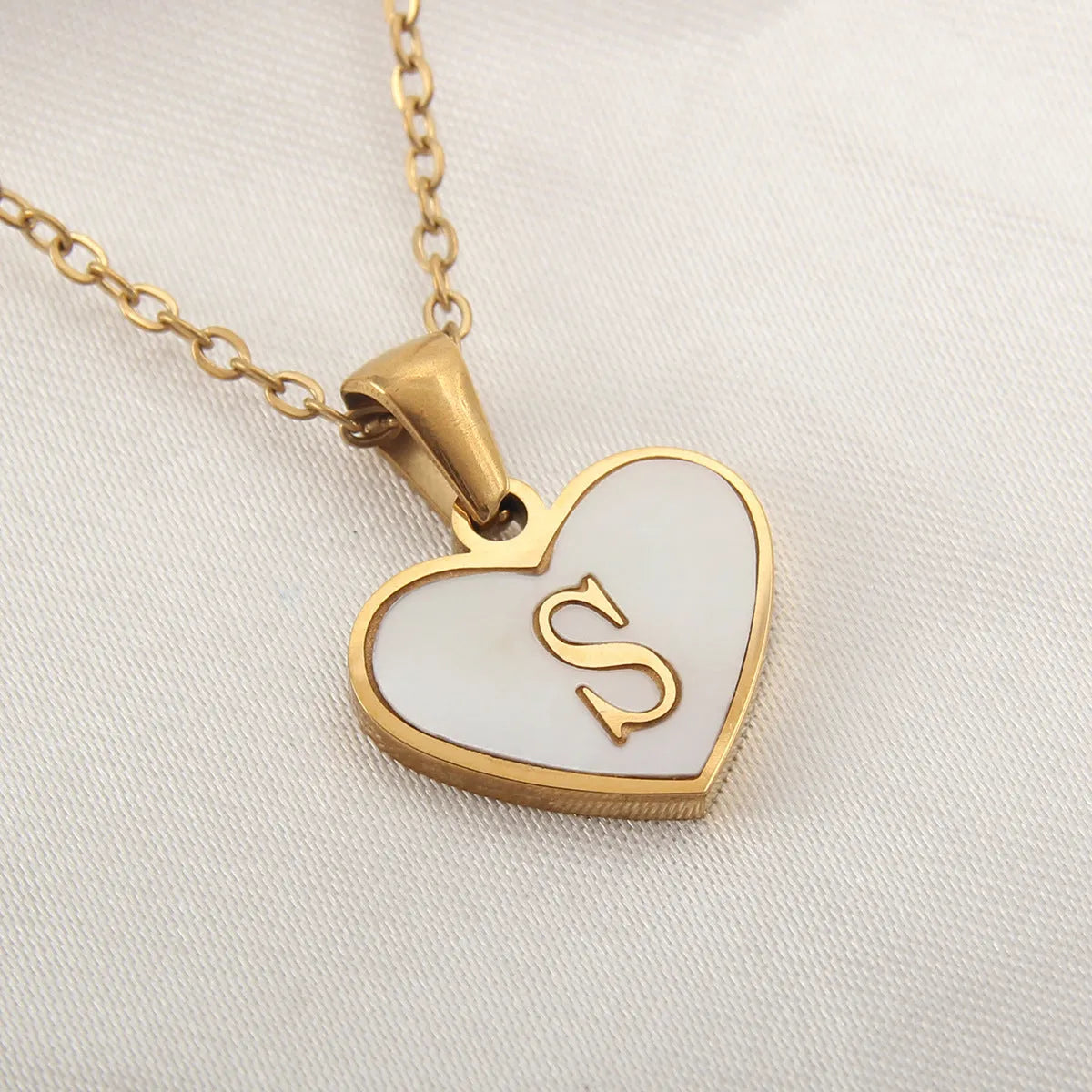 Gold plated personalised heart necklace with white shell on a 45cm chain