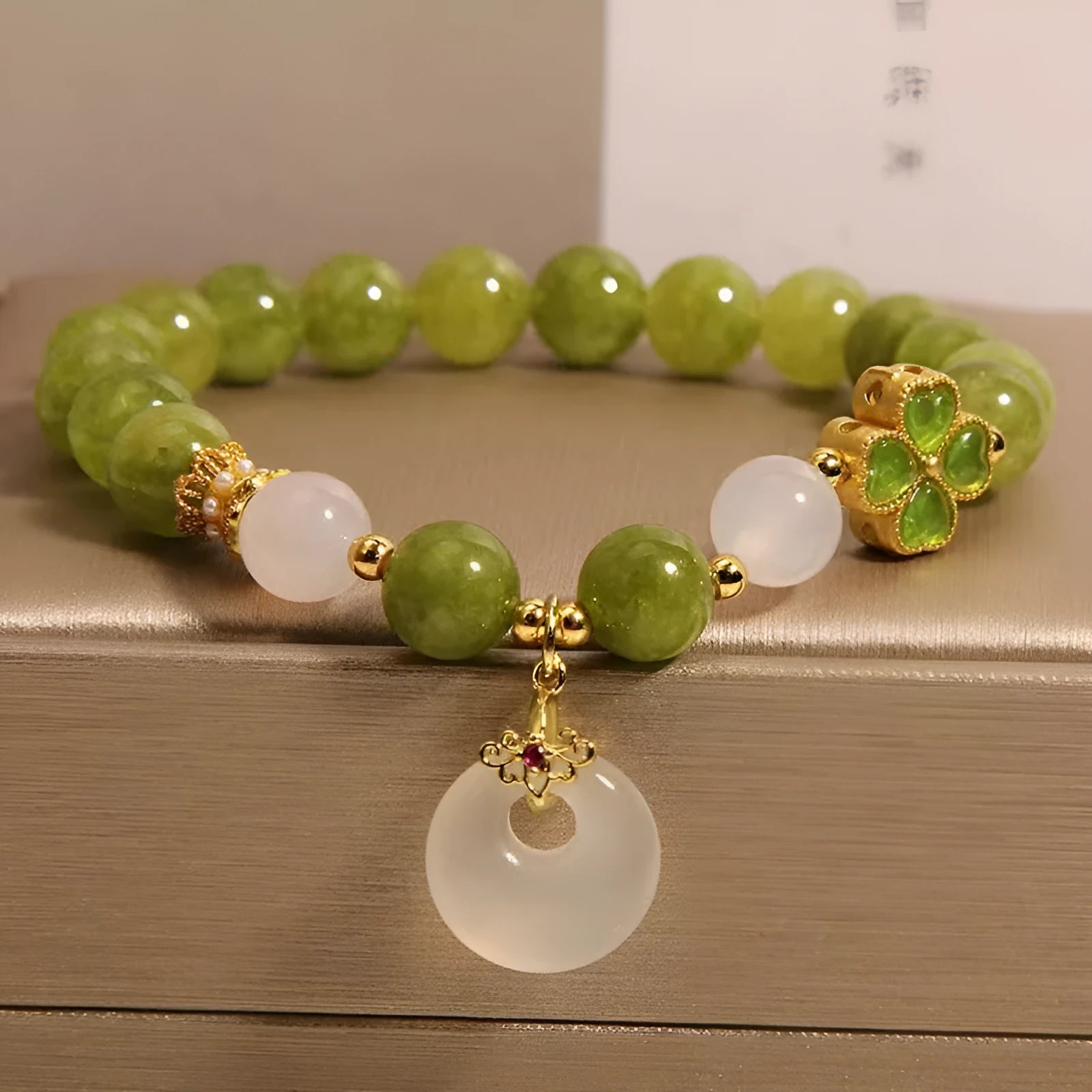 Natural stone green tourmaline women's bracelet with four-leaf clover charm and safety buckle closure