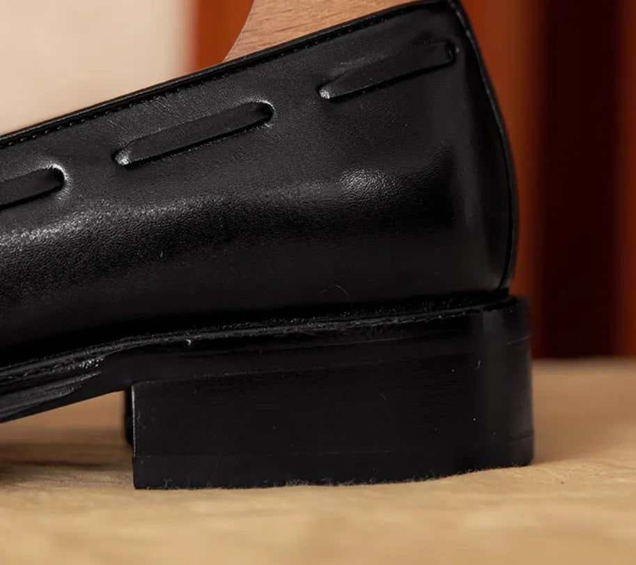 Men's black and brown genuine leather slip-on loafers with a pigskin lining, shown in multiple sizes.