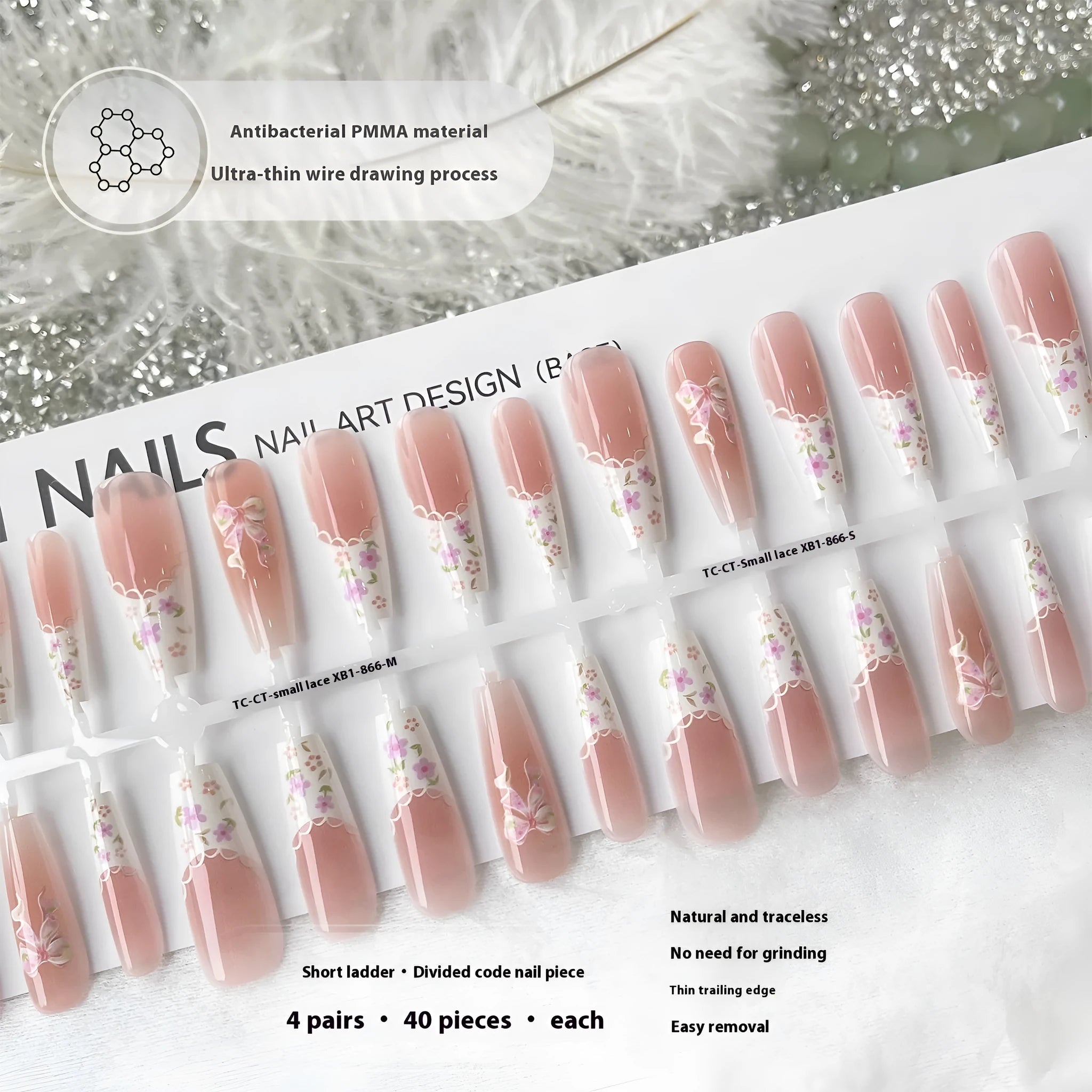 Set of 40 small floral prefabricated nail tips with long ladder velvet seal layer in white, displayed on a flat surface