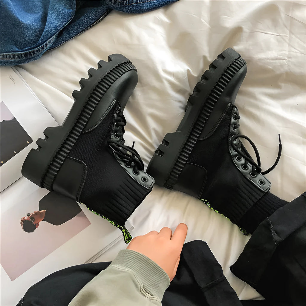 Black platform Dr. Martens boots with front zipper and frosted leather finish