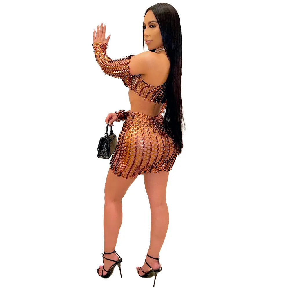 Women's black two-piece dress set with sleeveless top, short skirt, and hollow-out net detailing.
