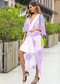 Light purple lace embroidered dress worn as a beach cover-up cardigan.