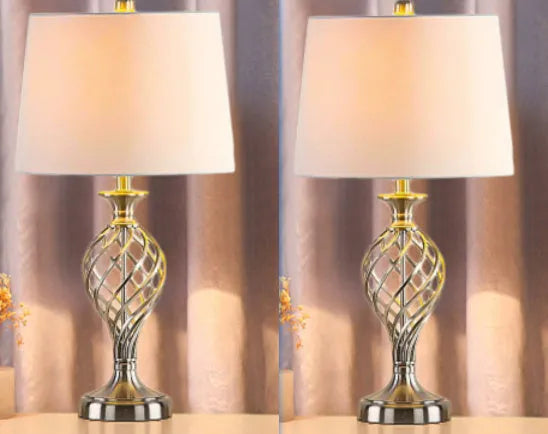 Silver alloy touch control bedside table lamp with USB cable on wooden surface