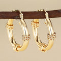 Copper geometric earrings for women in three golden colours with ring and line design elements