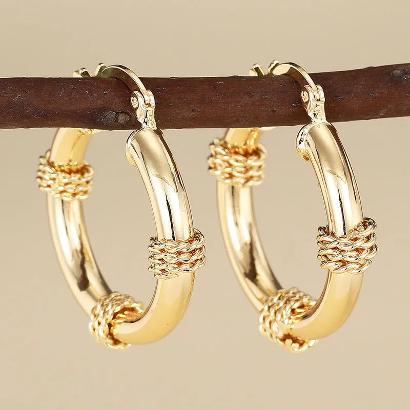Copper geometric earrings for women in three golden colours with ring and line design elements