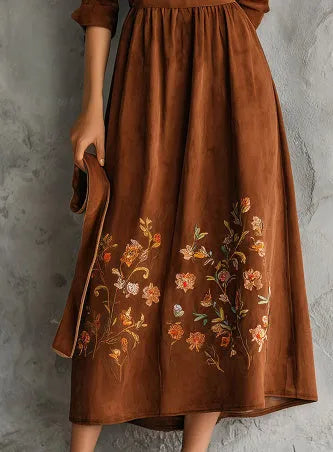 Brown midi dress with floral embroidery on suede-textured fabric, knee-length vintage style