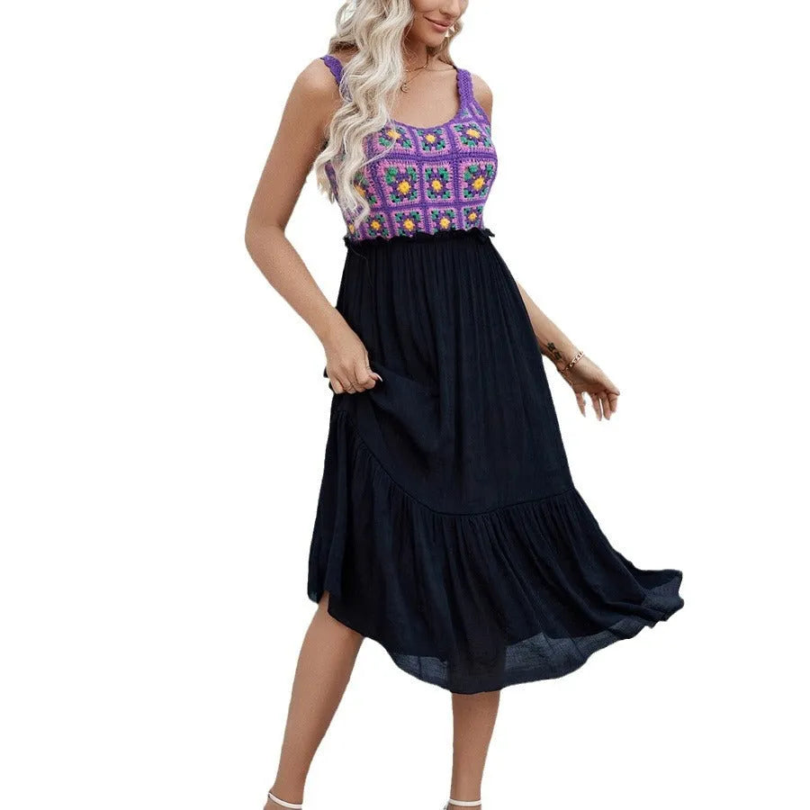 Purple sleeveless dress with hand-stitched floral embroidery on the front, shown on a mannequin.