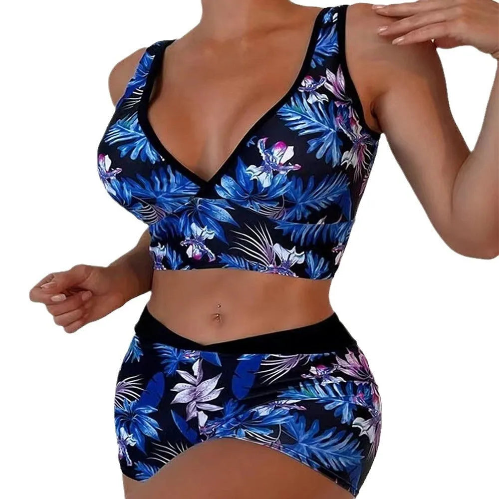 Women's two-piece printed swimsuit with high-neck top and boxer shorts in a multi-colour design.