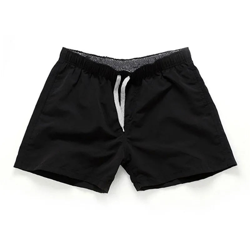 Men's straight-leg beach shorts in polyester, shown in a selection of available colours.