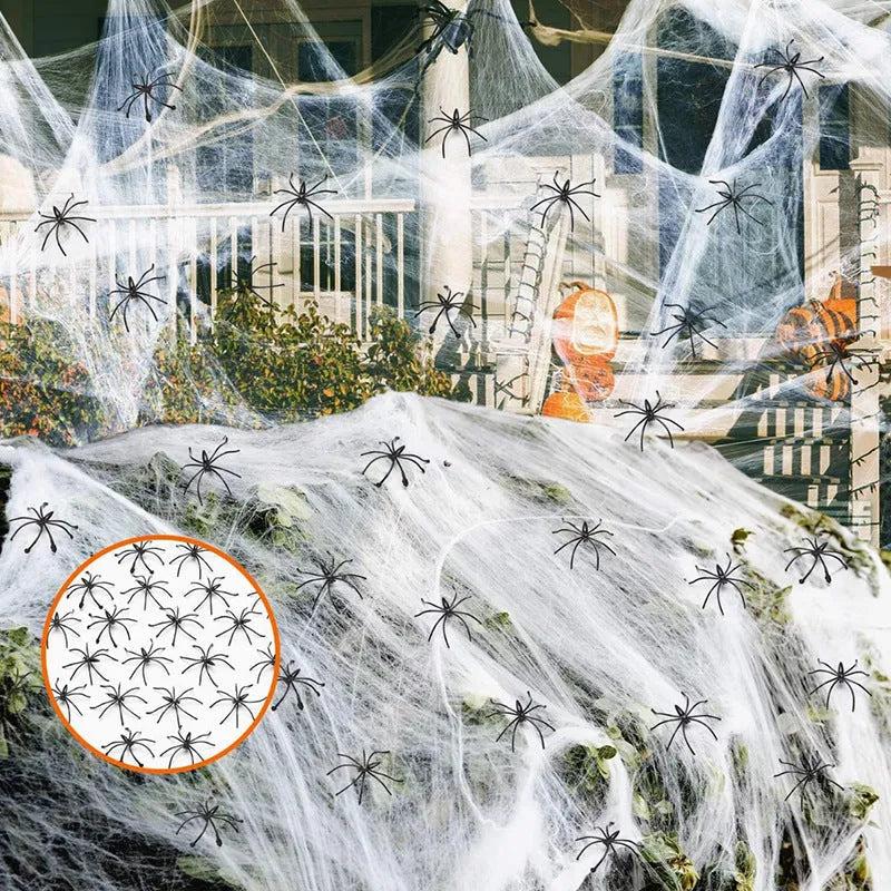 White cotton spider web Halloween decoration with plastic spiders for party or haunted house atmosphere