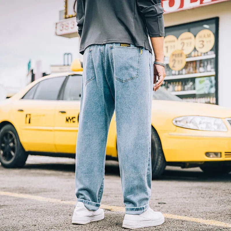 Men's loose straight jeans in dark blue colour showing mid waist and straight leg design
