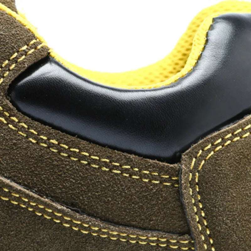 Bronze coloured low-cut steel toe safety boots with a cowhide suede upper and solid rubber sole.