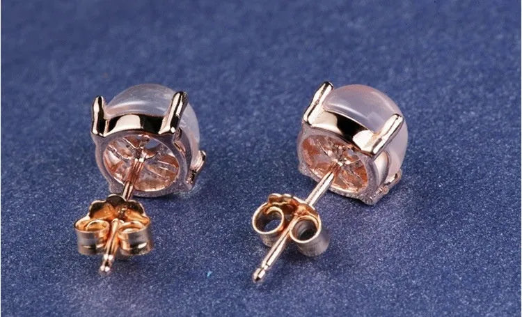 Rose gold drop shape synthetic quartz stud earrings with crystal inlay