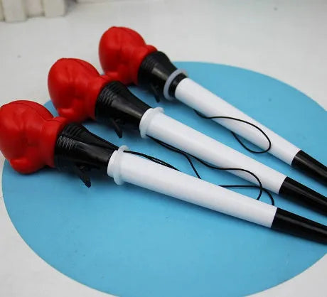 Set of four black ejection pens with a pressure relief boxing press button on the barrel.