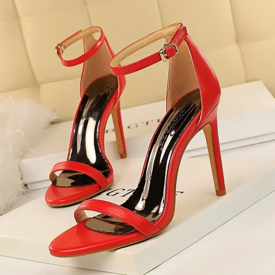 Open toe ankle strap high heels in artificial PU leather with buckle fastening