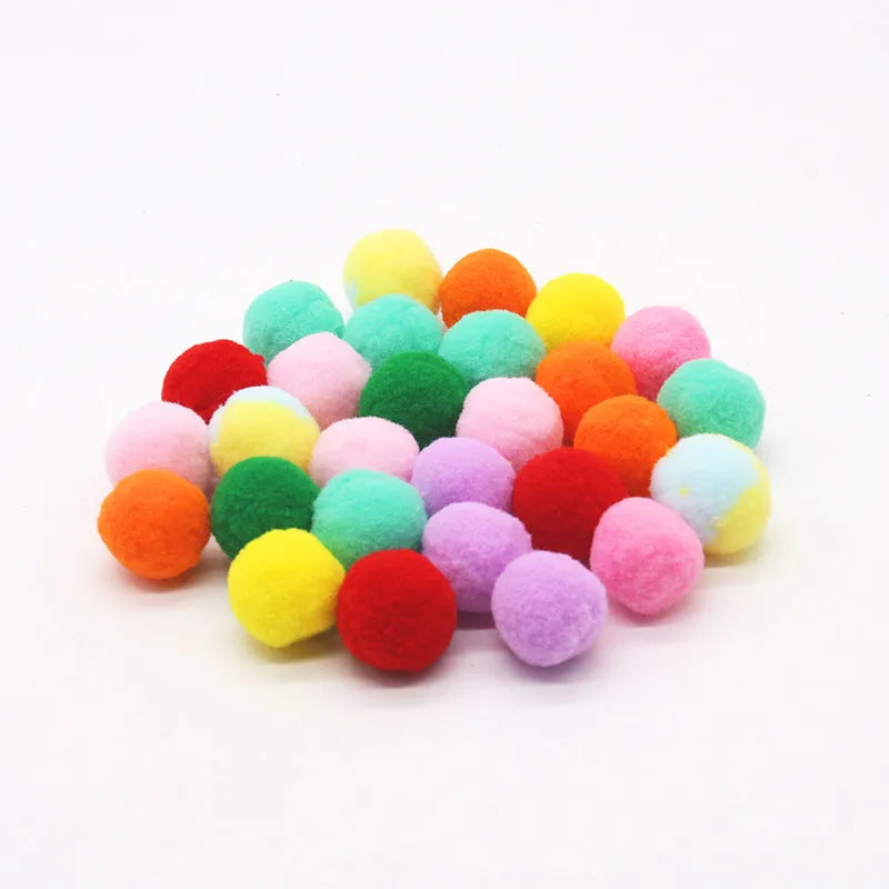 Plush ball launcher dog toy with soft pom-pom balls for indoor fetch games