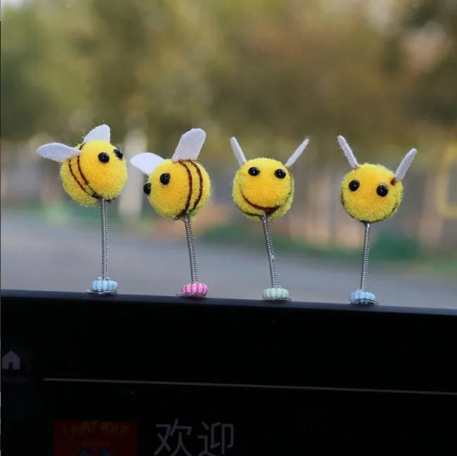 Swing spring bee car decoration with fur ball construction and cartoon design measuring 3x3cm