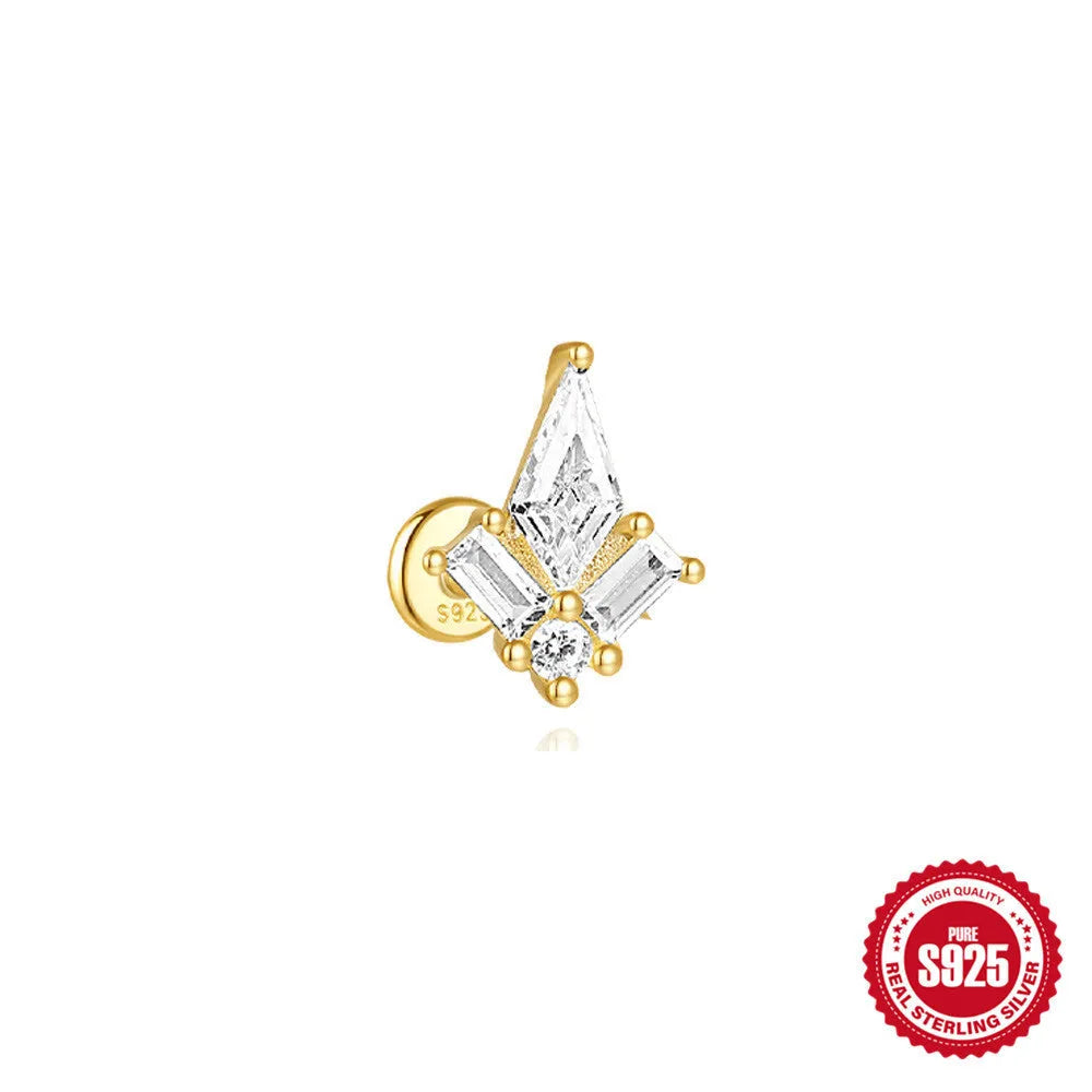 Geometric kite-shaped sterling silver earring with rhinestone head and gold chain tassel.