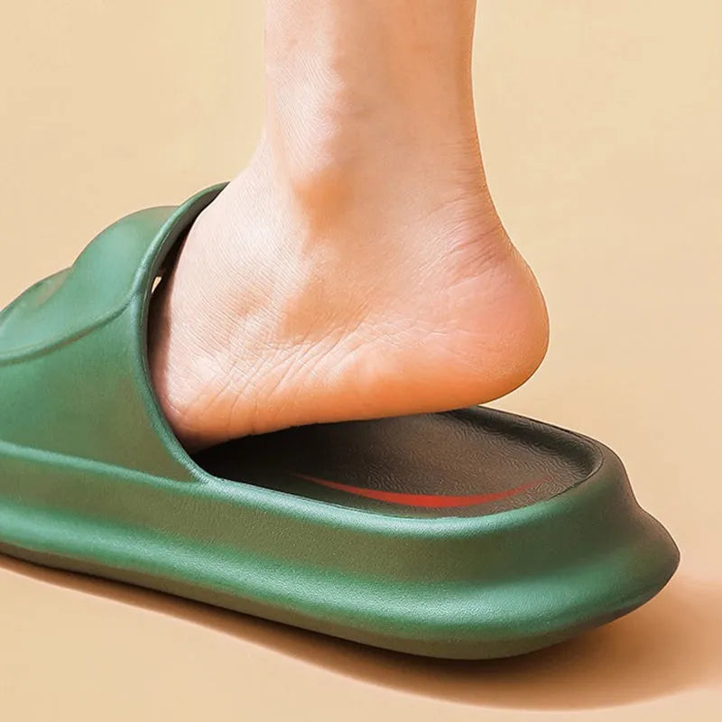 Pair of thick-soled EVA flip flop slippers in purple, showing deep sole profile.