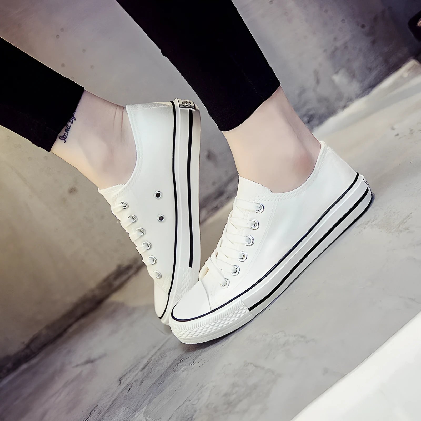 Solid colour canvas shoes for women on a plain background, showing the casual low-top design.