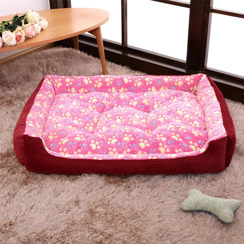 Beige plush sofa-style pet bed for a small dog, showing bolstered sides and padded construction.