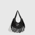 Retro style black shoulder handbag with a tassel decoration, shown with interior mobile phone pocket.