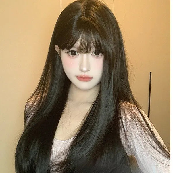 Dark brown long straight synthetic wig with a fringe on a wig head stand.